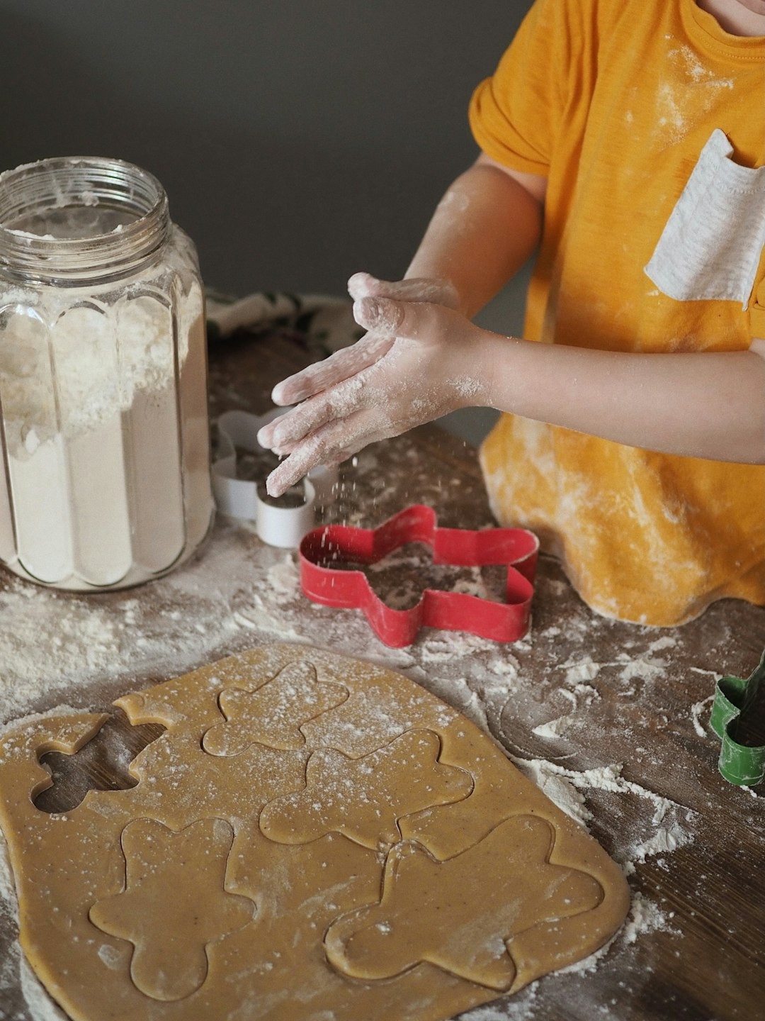 kid age 4-10 baking cookies 